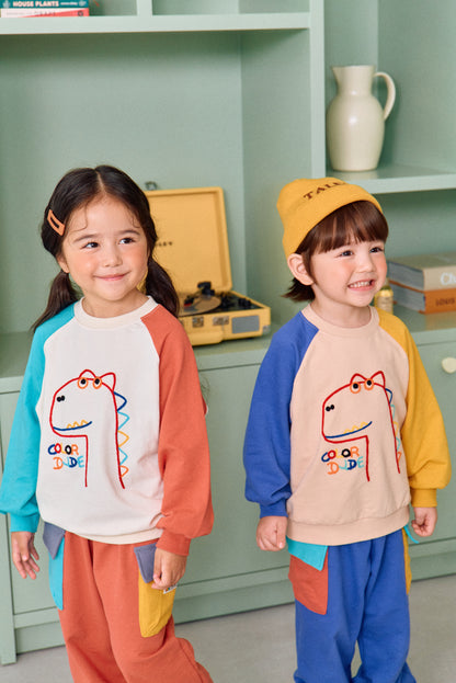 [BLU09] Colored dinosaur raglan T-shirt